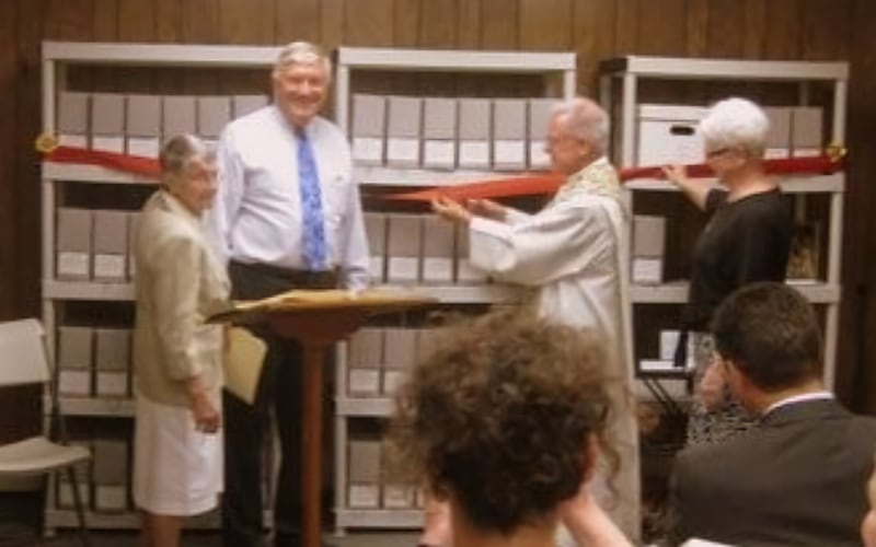 Pictured from left: Sister Nadine Boyle, RSM, Bob Golon, Parish Archivist, Fr. John Paul Alvarado, Pastor, and Sister Kathleen Rooney, SSJ at the opening ceremony of the Sacred Heart Archives. June, 2015.